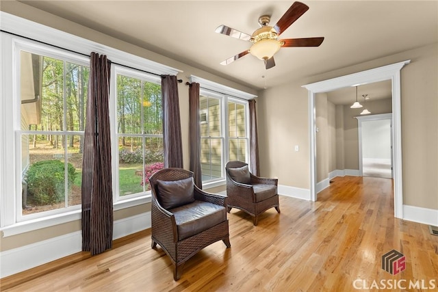 147 Rapids Dr, Bogart, GA 30622 - living area with light wood finished floors, a ceiling fan, and baseboards
