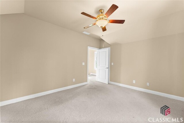 147 Rapids Dr, Bogart, GA 30622 - empty room featuring lofted ceiling, visible vents, baseboards, light carpet, and a ceiling fan