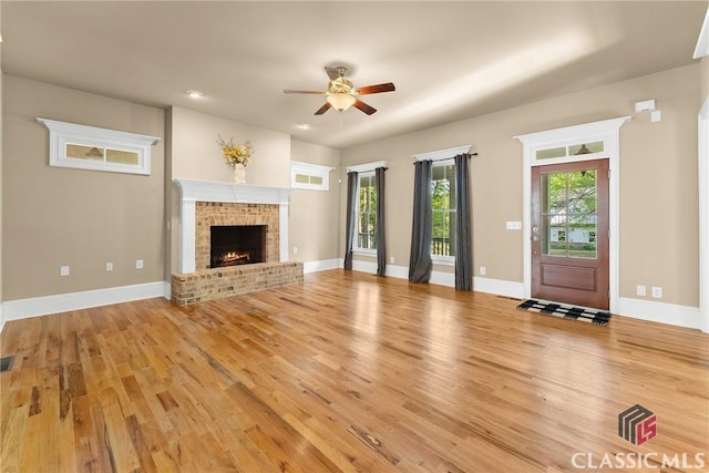 147 Rapids Dr, Bogart, GA 30622 - unfurnished living room featuring light wood-type flooring, ceiling fan, a fireplace, and recessed lighting