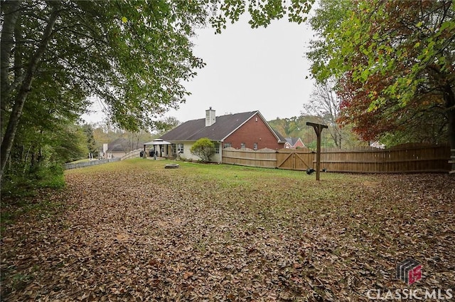 view of yard with a fenced backyard