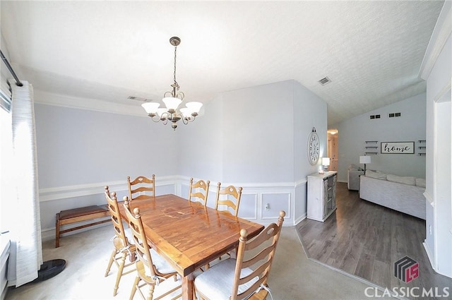 dining space with an inviting chandelier and visible vents