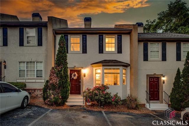 132 Tamara Ct, Athens, GA 30606 - townhome / multi-family property featuring stucco siding, a chimney, and uncovered parking