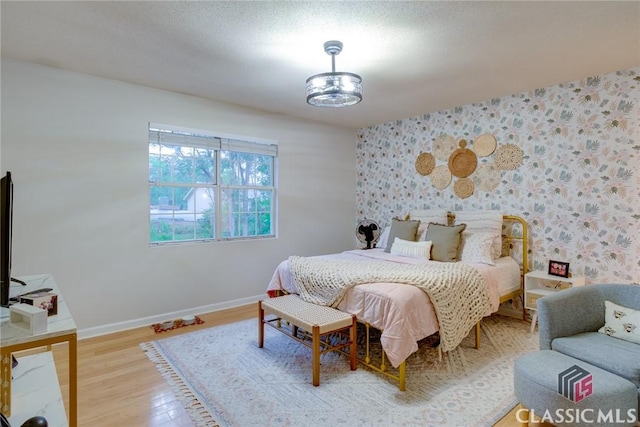 132 Tamara Ct, Athens, GA 30606 - bedroom featuring baseboards, wallpapered walls, and wood finished floors