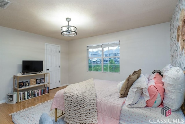 132 Tamara Ct, Athens, GA 30606 - bedroom with baseboards, visible vents, and wood finished floors
