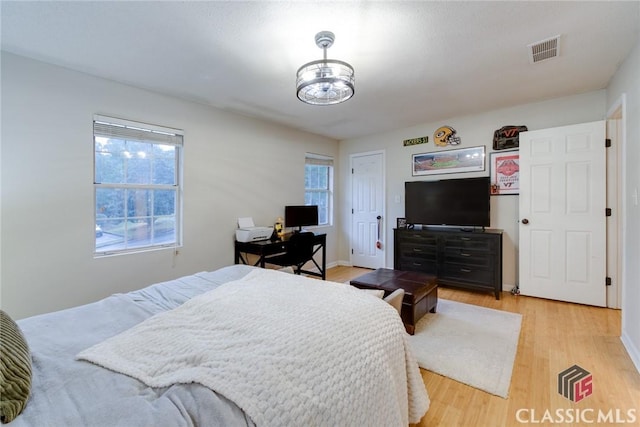 132 Tamara Ct, Athens, GA 30606 - bedroom with an inviting chandelier, visible vents, and light wood-style floors