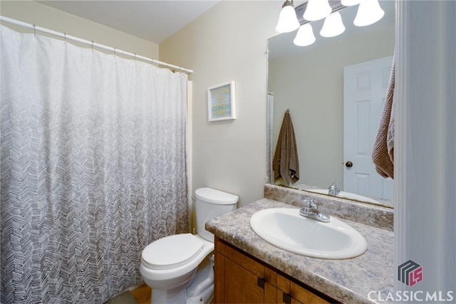 132 Tamara Ct, Athens, GA 30606 - bathroom featuring an inviting chandelier, toilet, and vanity