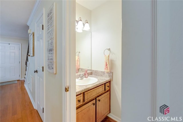 132 Tamara Ct, Athens, GA 30606 - bathroom with crown molding, wood finished floors, vanity, and baseboards