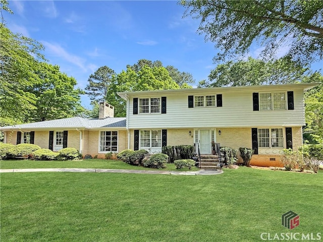 155 Broomsedge Trl, Athens, GA 30605 - view of front of home with brick siding, a chimney, and a front yard