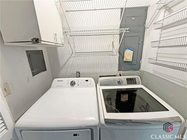 155 Broomsedge Trl, Athens, GA 30605 - washroom featuring washing machine and clothes dryer, cabinet space, and electric panel