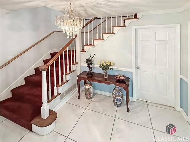 155 Broomsedge Trl, Athens, GA 30605 - staircase with crown molding, baseboards, a notable chandelier, and visible vents