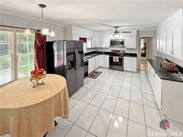 155 Broomsedge Trl, Athens, GA 30605 - kitchen with dark countertops, appliances with stainless steel finishes, ornamental molding, and ceiling fan