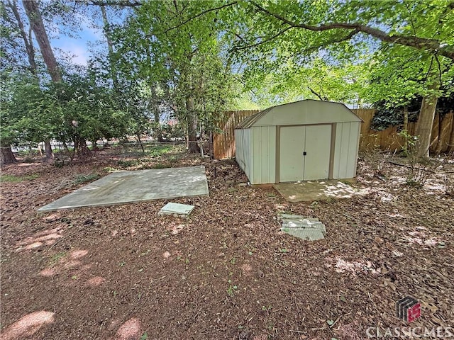 155 Broomsedge Trl, Athens, GA 30605 - view of yard with an outdoor structure, a shed, and a fenced backyard
