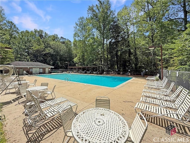 155 Broomsedge Trl, Athens, GA 30605 - community pool featuring a patio and fence