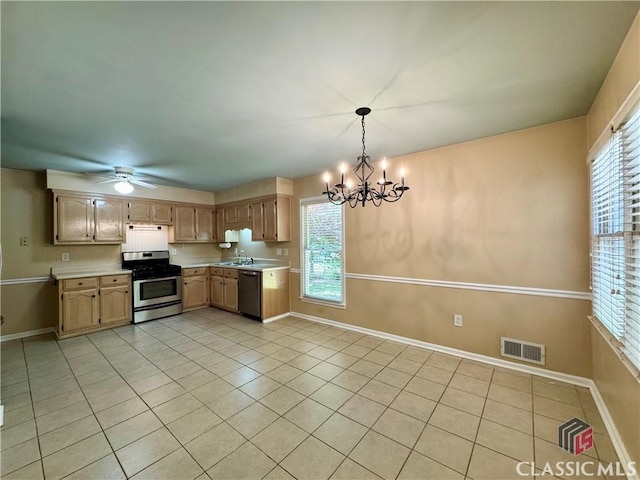 kitchen with light countertops, stainless steel gas range oven, visible vents, and dishwasher