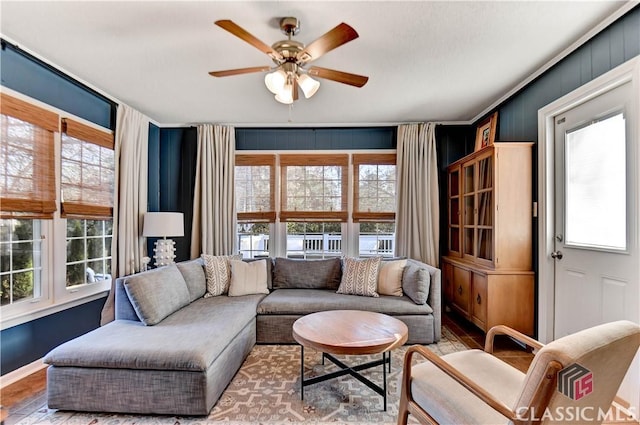 living room with ceiling fan and wood finished floors