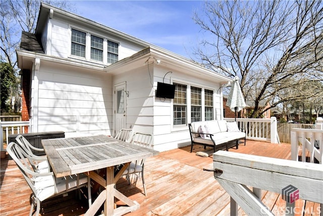 deck featuring an outdoor living space and outdoor dining space