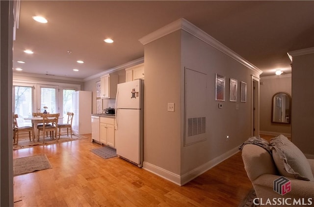 490 Barnett Shoals Rd Unit 802, Athens, GA 30605 - kitchen featuring crown molding, light wood-style flooring, white cabinetry, and white appliances