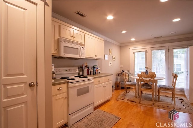 490 Barnett Shoals Rd Unit 802, Athens, GA 30605 - kitchen featuring ornamental molding, white appliances, visible vents, and a wealth of natural light