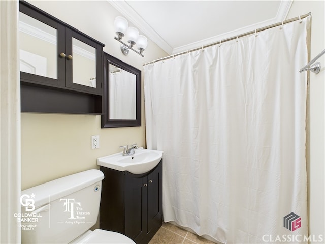 bathroom with crown molding, tile patterned floors, toilet, and vanity