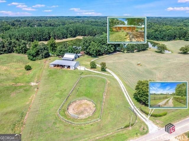 bird's eye view with a view of trees and a rural view