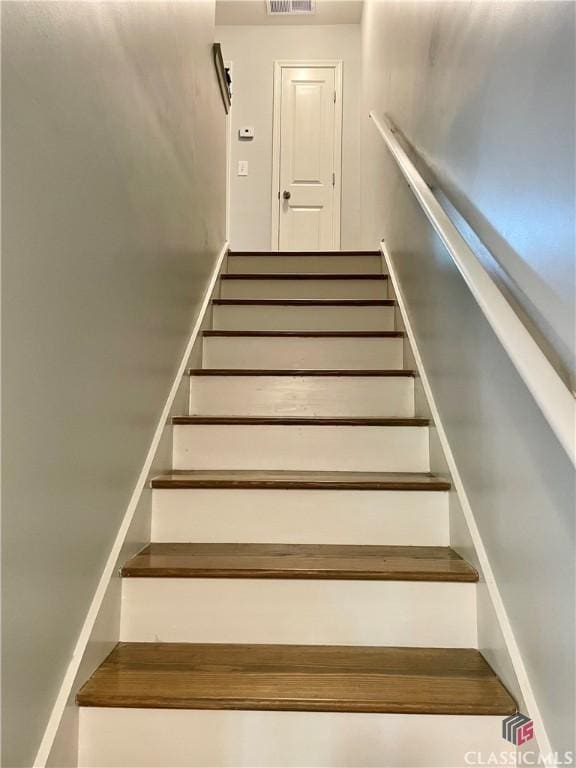 staircase with visible vents