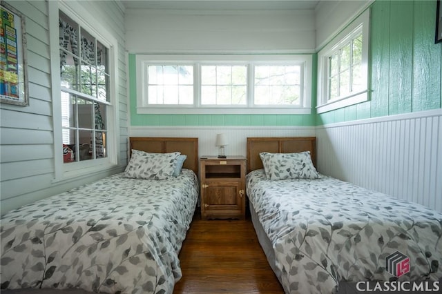 bedroom featuring dark wood finished floors