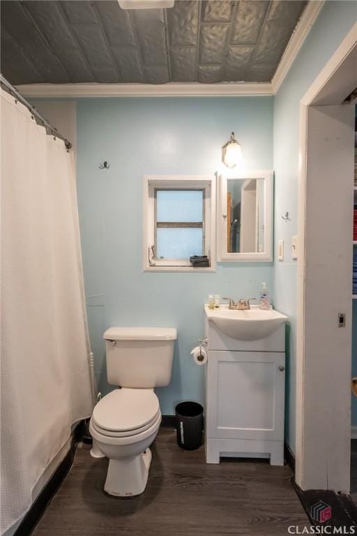 bathroom featuring crown molding, wood finished floors, vanity, an ornate ceiling, and toilet