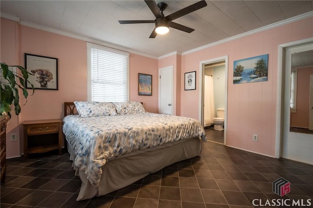 bedroom with dark tile patterned flooring, ornamental molding, ceiling fan, and connected bathroom
