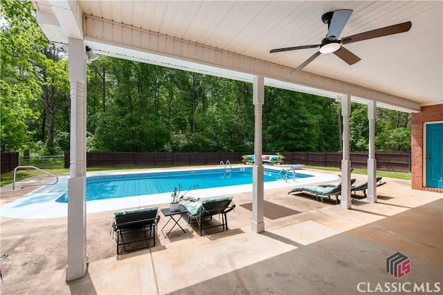 view of swimming pool with a patio, ceiling fan, a fenced in pool, and a fenced backyard