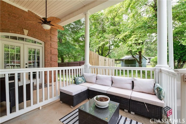 view of patio / terrace featuring french doors, fence, a ceiling fan, and outdoor lounge area