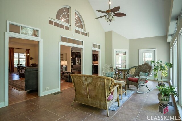 sunroom featuring plenty of natural light, visible vents, and a chandelier