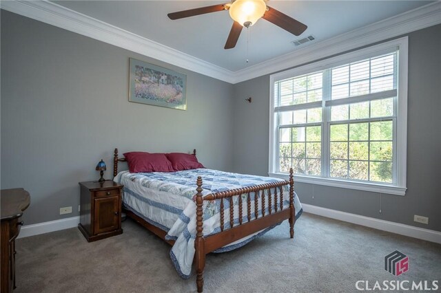 bedroom featuring visible vents, ornamental molding, baseboards, and carpet flooring