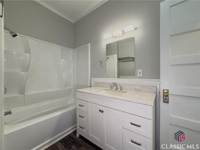 full bathroom with vanity,  shower combination, and wood finished floors