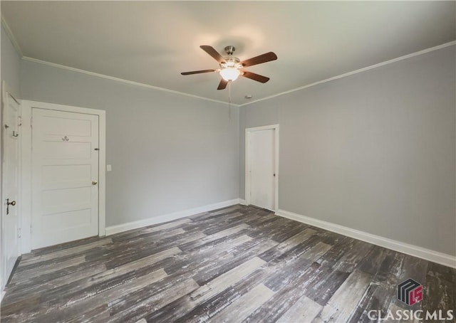 unfurnished room with baseboards, ornamental molding, ceiling fan, and wood finished floors