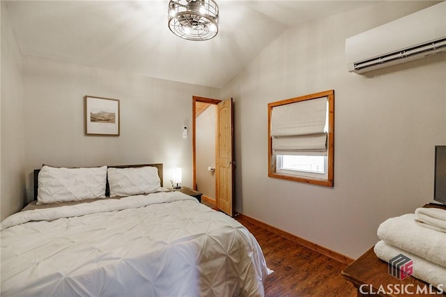 50 Atlanta Ln, Clayton, GA 30525 - bedroom featuring baseboards, a wall unit AC, vaulted ceiling, and wood finished floors