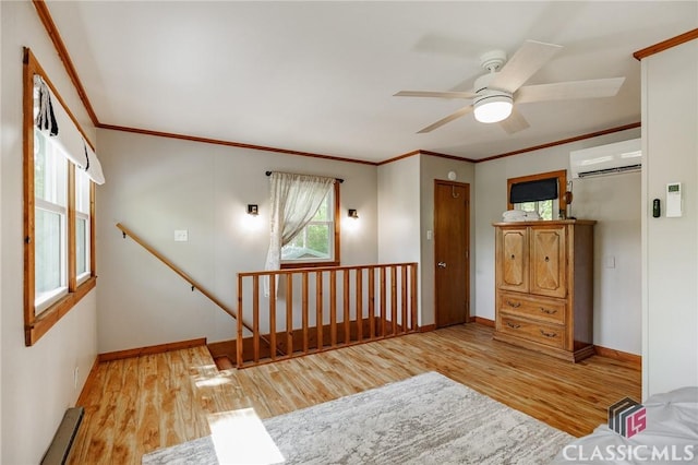 50 Atlanta Ln, Clayton, GA 30525 - interior space with wood finished floors, a baseboard radiator, crown molding, and a wall unit AC