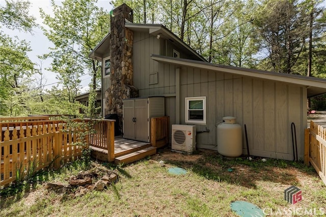 50 Atlanta Ln, Clayton, GA 30525 - exterior space with a wooden deck, fence, a chimney, ac unit, and a yard