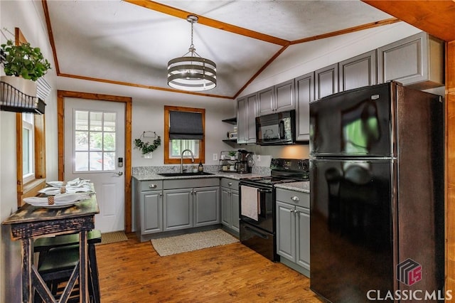 50 Atlanta Ln, Clayton, GA 30525 - kitchen featuring light wood-type flooring, black appliances, a sink, vaulted ceiling, and gray cabinetry