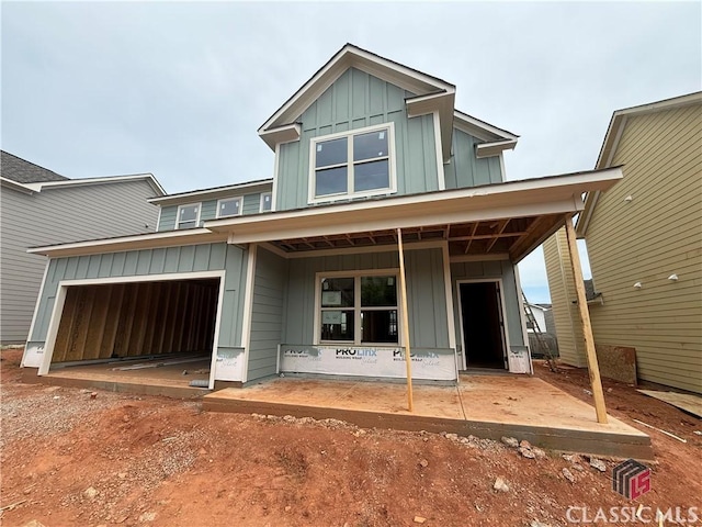 341 Ridge Pointe Dr, Athens, GA 30606 - view of front of house featuring board and batten siding, a garage, and covered porch