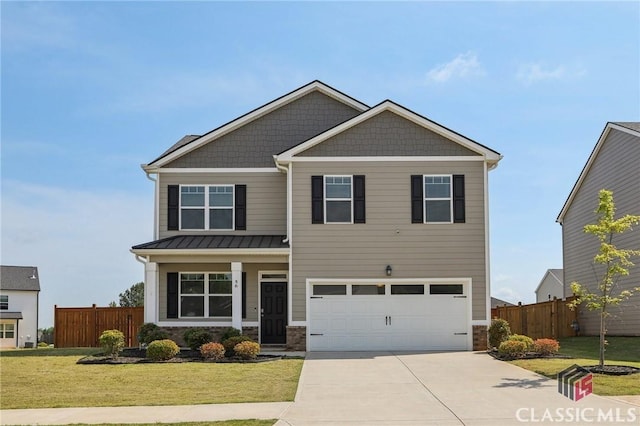 craftsman inspired home with fence, an attached garage, driveway, and a front yard