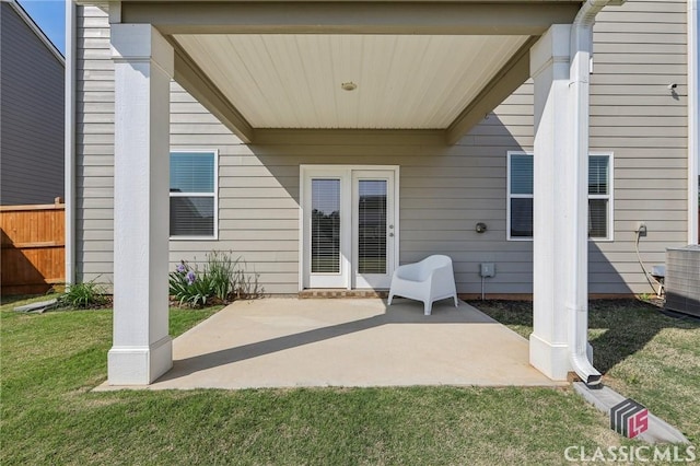 view of patio / terrace with central AC and fence
