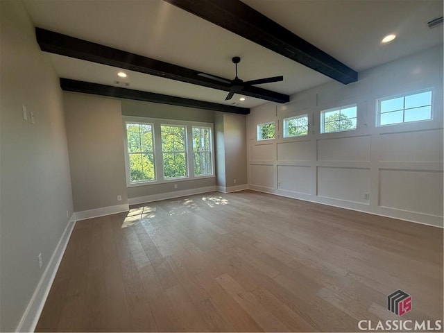 1200 Askew Trl, Greensboro, GA 30642 - spare room featuring ceiling fan, beam ceiling, wood finished floors, a decorative wall, and recessed lighting