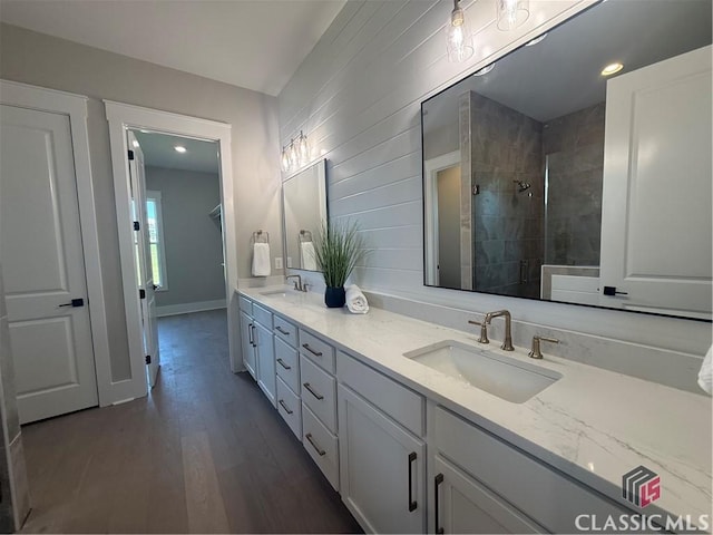 1200 Askew Trl, Greensboro, GA 30642 - full bath featuring double vanity, a tile shower, wood finished floors, and recessed lighting