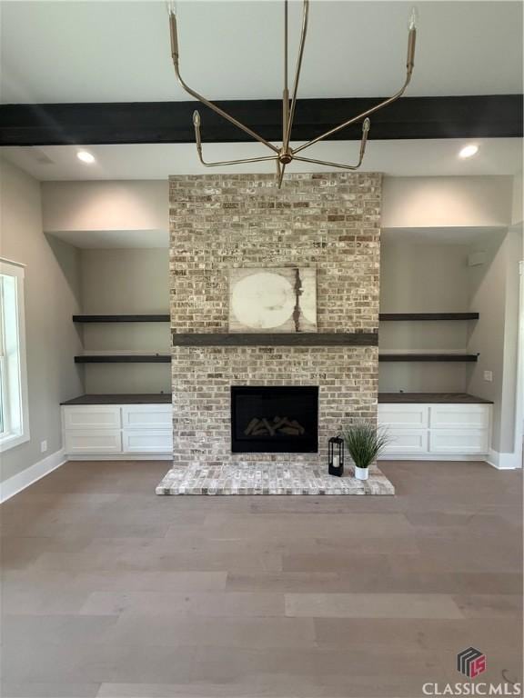 1200 Askew Trl, Greensboro, GA 30642 - unfurnished living room with a fireplace, wood finished floors, and recessed lighting
