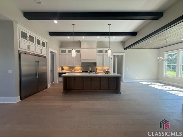 1200 Askew Trl, Greensboro, GA 30642 - kitchen featuring appliances with stainless steel finishes, wood finished floors, beam ceiling, white cabinets, and light countertops
