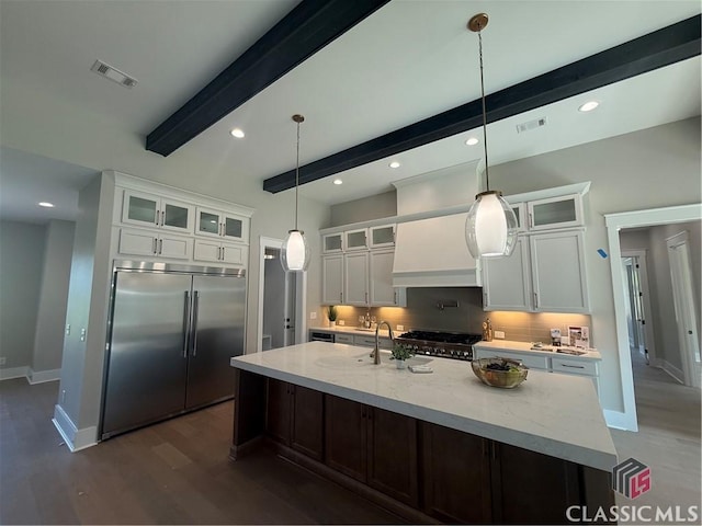 1200 Askew Trl, Greensboro, GA 30642 - kitchen featuring built in fridge, beam ceiling, white cabinetry, a spacious island, and dark wood-type flooring