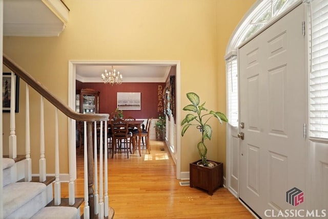 1130 Latham Dr, Watkinsville, GA 30677 - living room featuring crown molding, a ceiling fan, light wood-style flooring, and baseboards