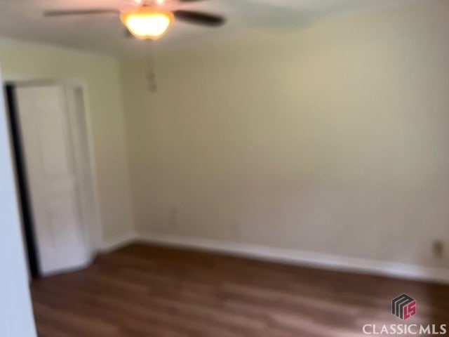 unfurnished bedroom with baseboards, ceiling fan, and wood finished floors