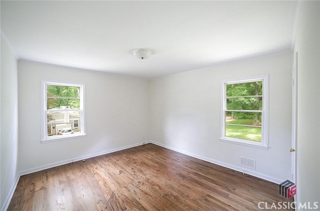 120 Hunt Rd, Athens, GA 30606 - empty room featuring visible vents, ornamental molding, baseboards, and wood finished floors