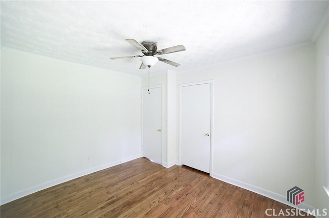 120 Hunt Rd, Athens, GA 30606 - spare room with crown molding, baseboards, ceiling fan, and wood finished floors